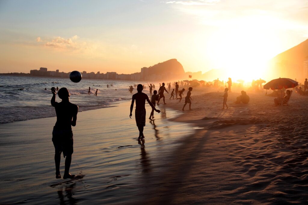 people, beach, sea, coast, sand, tourists, rio, brazil, soccer, football, ball, playing, ray, ocean, copacabana, sunset, nature, rio de janeiro