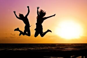 new year background, sunset, beach, silhouettes, jump, nature, jumping, youth, active, happy, pair, girls, young women, people, joy, freedom, seaside, dusk